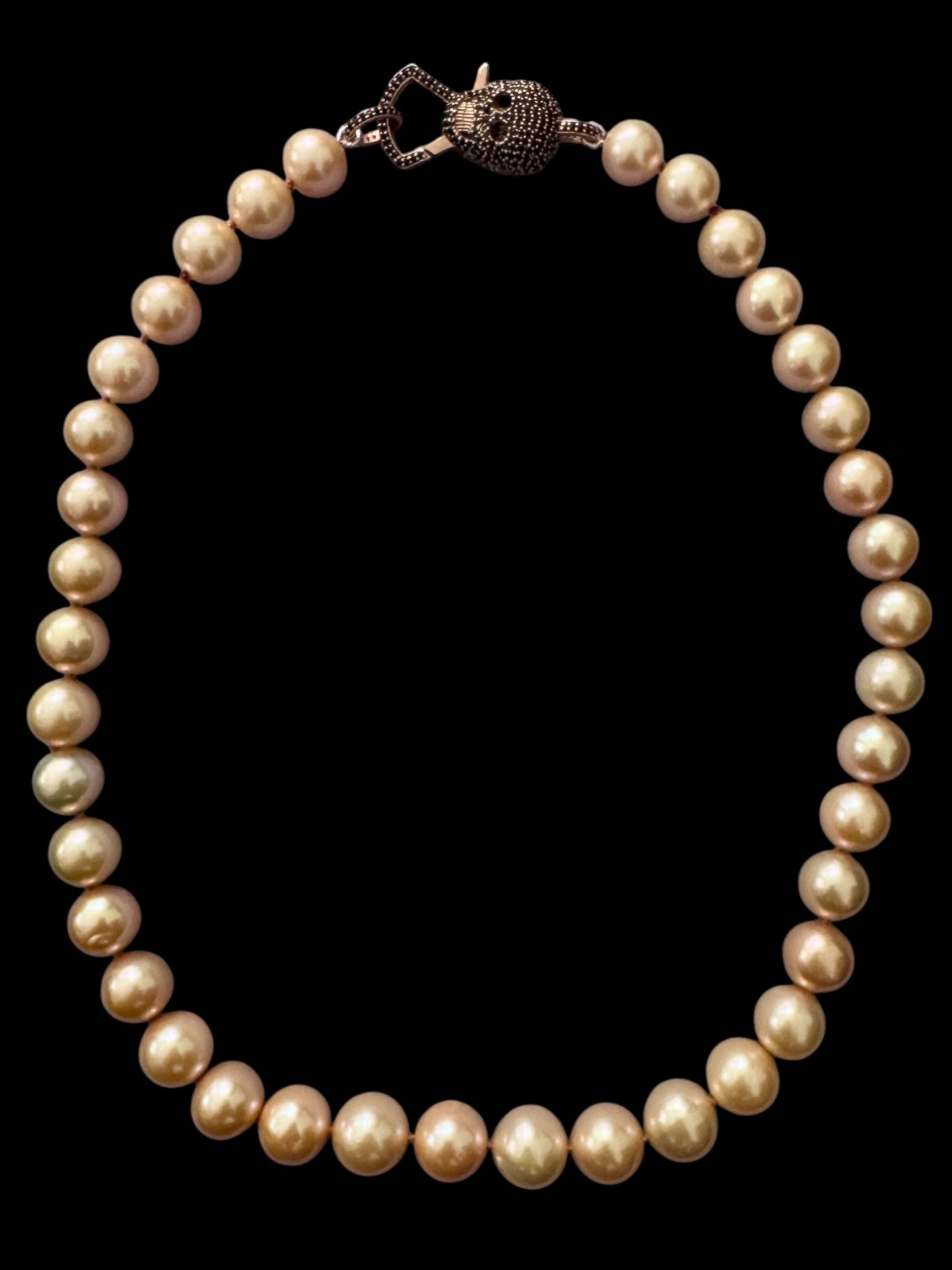 Solar Reign – Golden Peach Edison Pearl Necklace with Rose Gold Black Spinel Skull Clasp