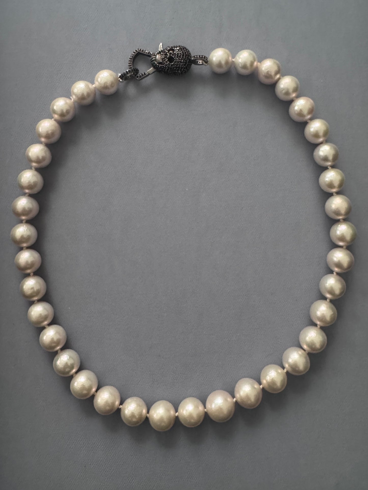 Luminous Edge – White Edison Pearl & Black Spinel Skull Necklace